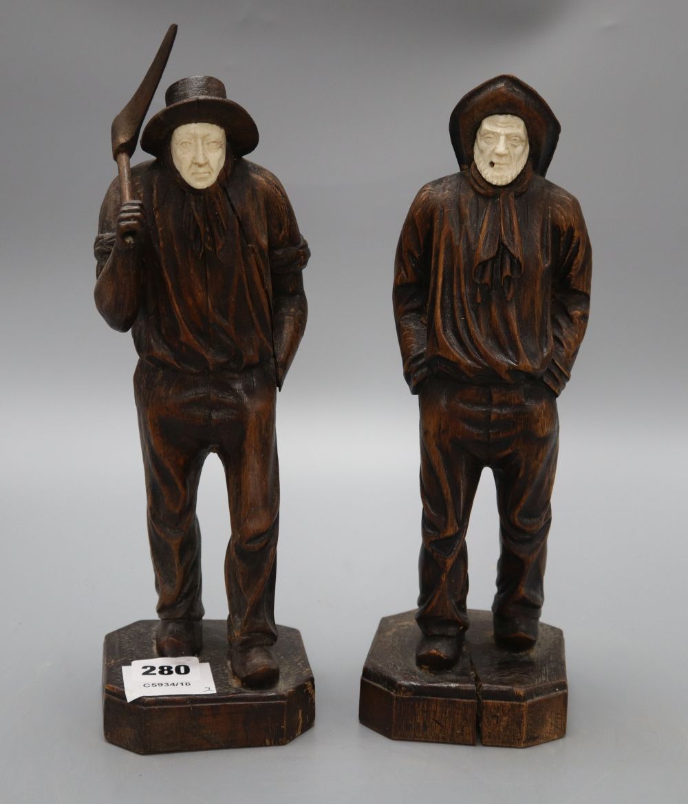 Two carved wood figures of workmen, with ivory faces, signed Neri, height 31cm